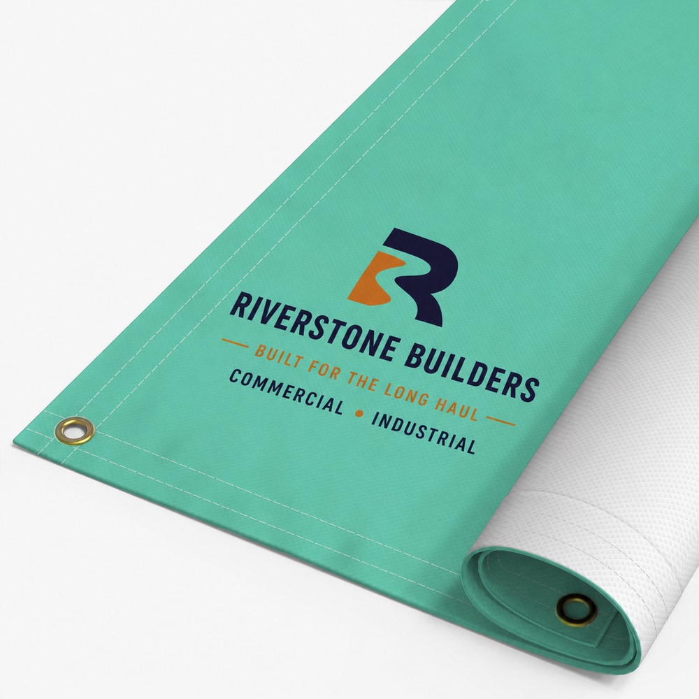 Riverstone Builders artwork printed on a rolled 18 oz blockout banner with hemmed edge and brass grommets